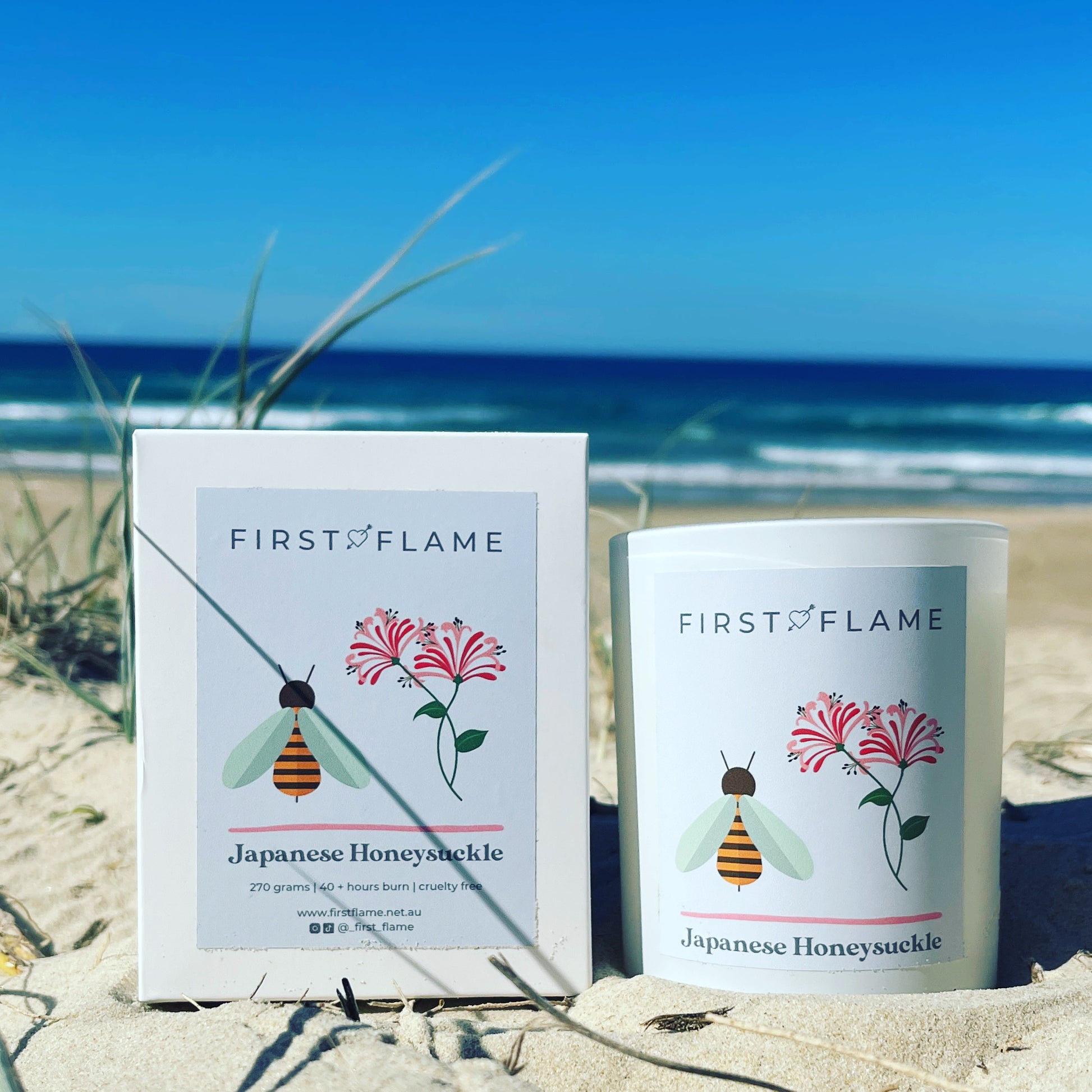 First Flame Japanese Honeysuckle candle with gift box by the beach